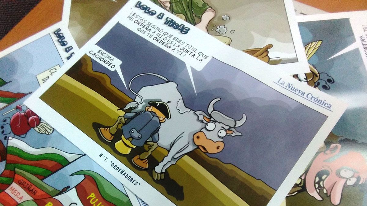 Lolo, junto a algunas de sus viñetas, en la exposición en Espacio Vías. | MAURICIO PEÑA